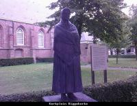 This typical peasant woman decorates the square surrounding the church.