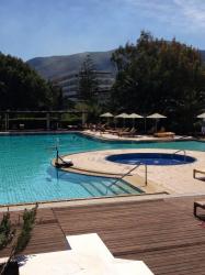 The nice, blue swimming pool of the Apollonia Beach Hotel in Heraklion, Crete, Greece.