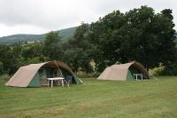 Two of the pyramid tents for rent at Huis op de Heuvel