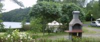 Pitch and lake from Camping Le Viaduc in Pers